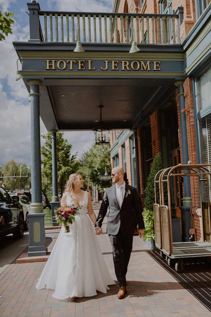 Bride and groom outside of Hotel Jerome for their elopement