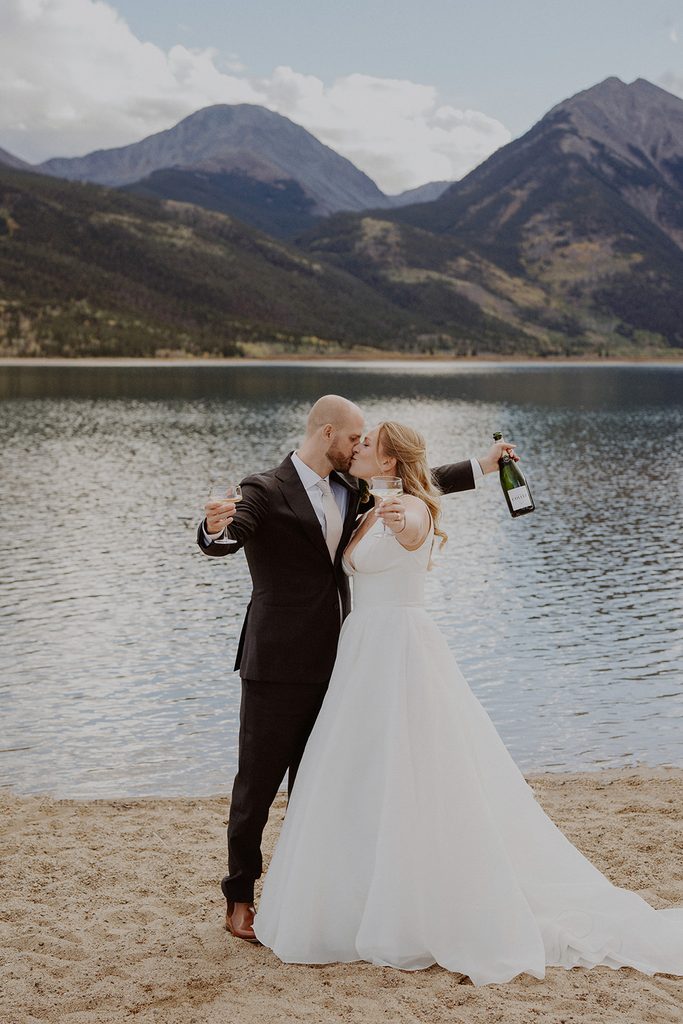 Bride and groom celebrate after their Aspen, Colorado Twin Lakes elopement ceremony