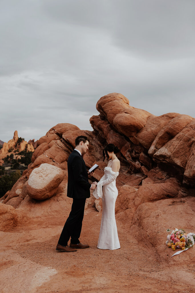 Groom reading his personal vows to his bride. 