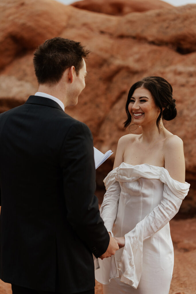 Groom reading his vows to the bride