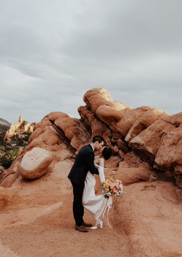 Bride and groom kissing during their Colorado Springs elopement in Garden of The Gods