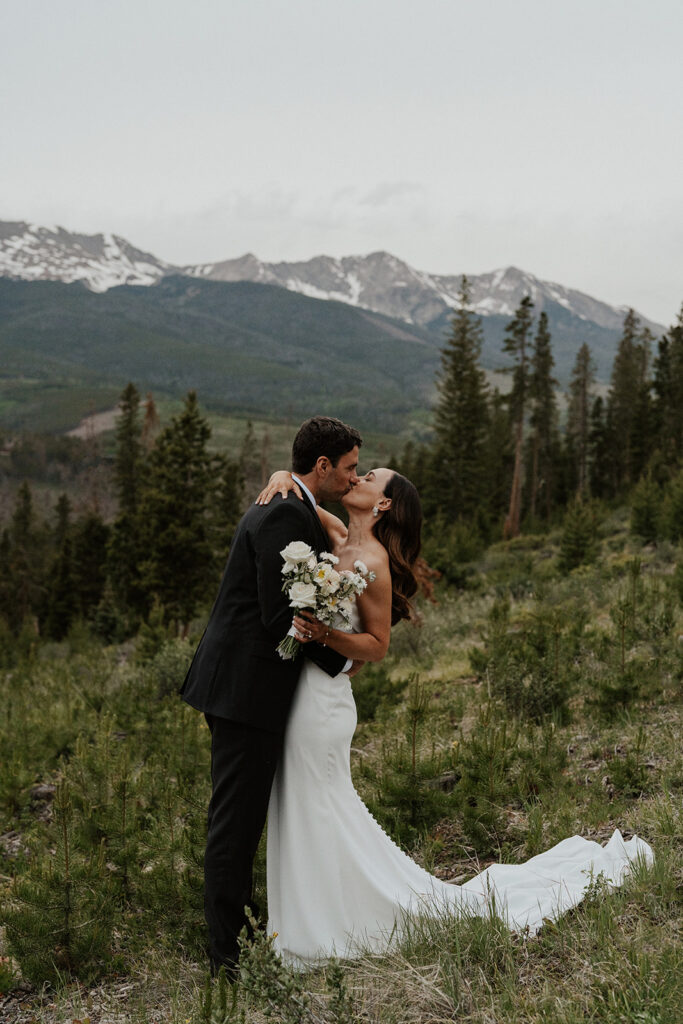 Bride and groom portraits in Breckenridge, Colorado with mountain views from their Airbnb elopement at Northwoods