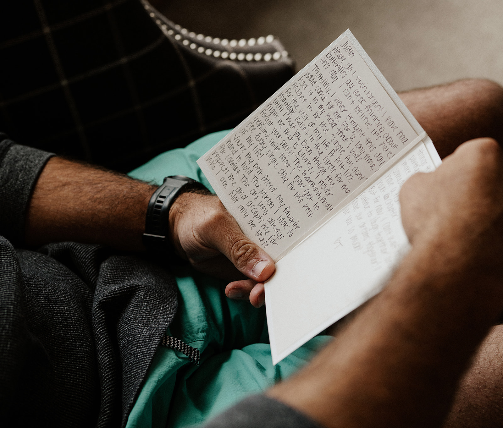 Groom reading a letter from his soon to be bride