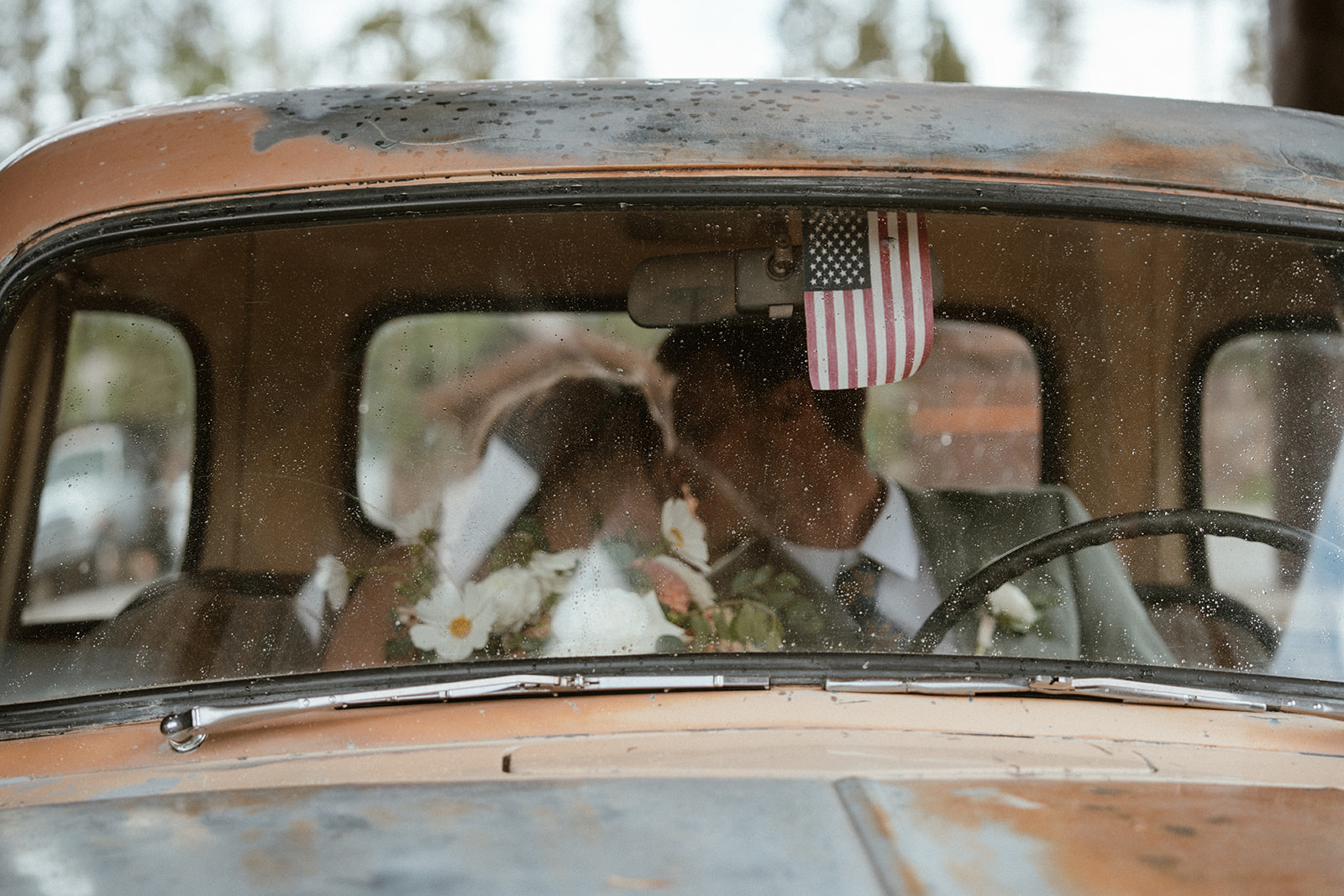 Bride and grooms elopement photos in an old Chevrolet truck