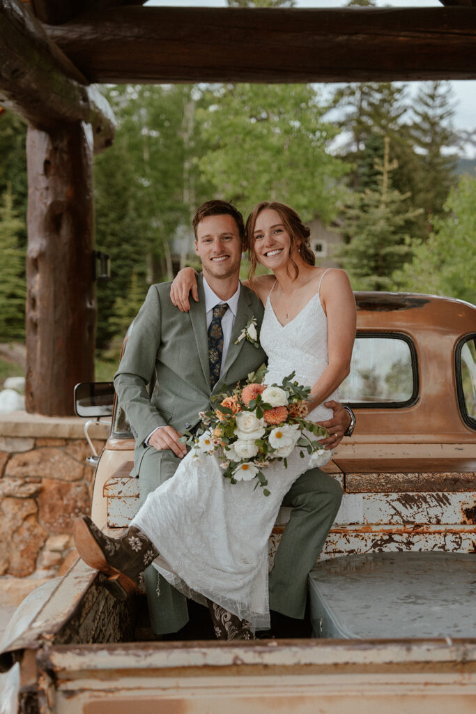 Bride and grooms elopement photos in an old Chevrolet truck