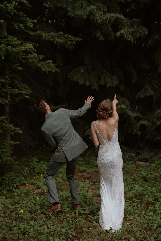 Bride and groom being funny during their wedding photos