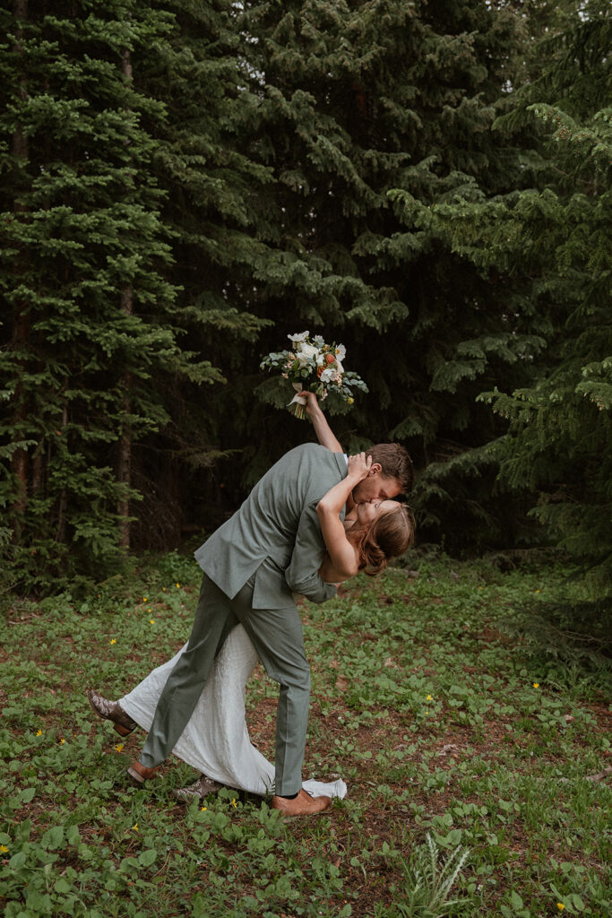 Bride and groom kissing during their intimate elopement in Colorado