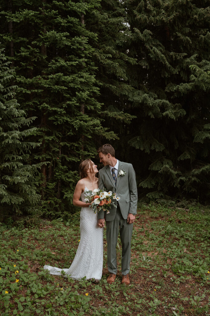 Bride and groom smiling at each other