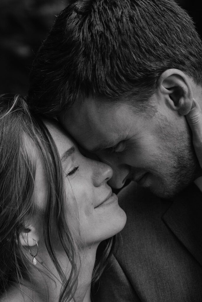 Black and white close up photo of a bride and groom