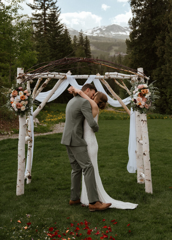 Bride and groom kissing during their intimate Colorado elopement ceremony in Breckenridge 