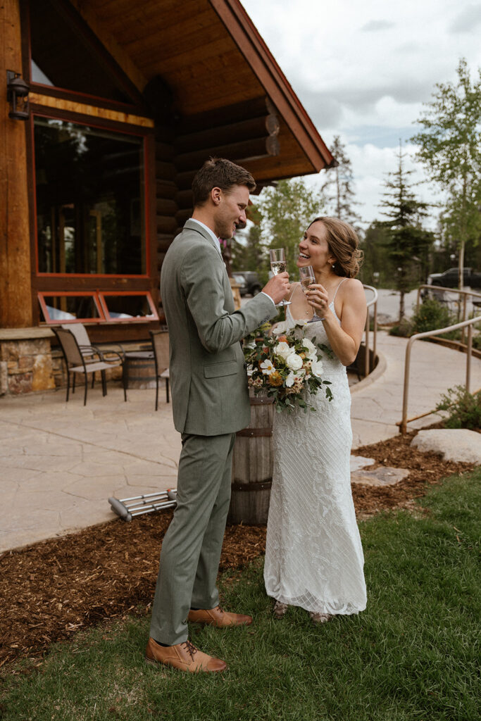 Bride and groom toasting with champagne after their elopement cermeony