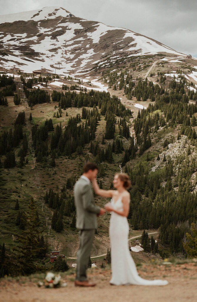 Out of focus wedding photo of a Colorado mountain elopement on Peak 9 in Breckenridge