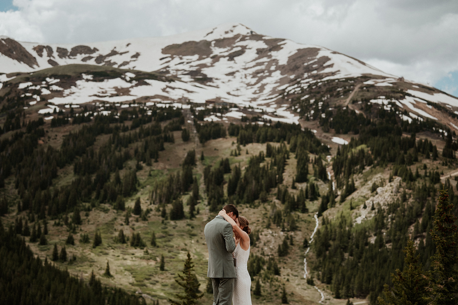 Bride and groom hugging during their Colorado mountain elopement on Peak 9 in Breckenridge 