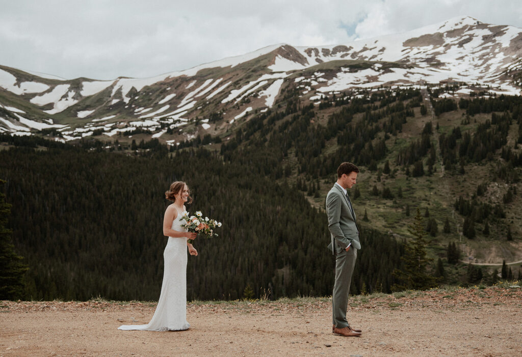 Bride and groom about to share their first look during their Colorado mountain elopement on Peak 9 in Breckenridge