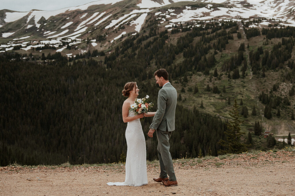 Bride and grooms first look during their Colorado mountain elopement on Peak 9 in Breckenridge