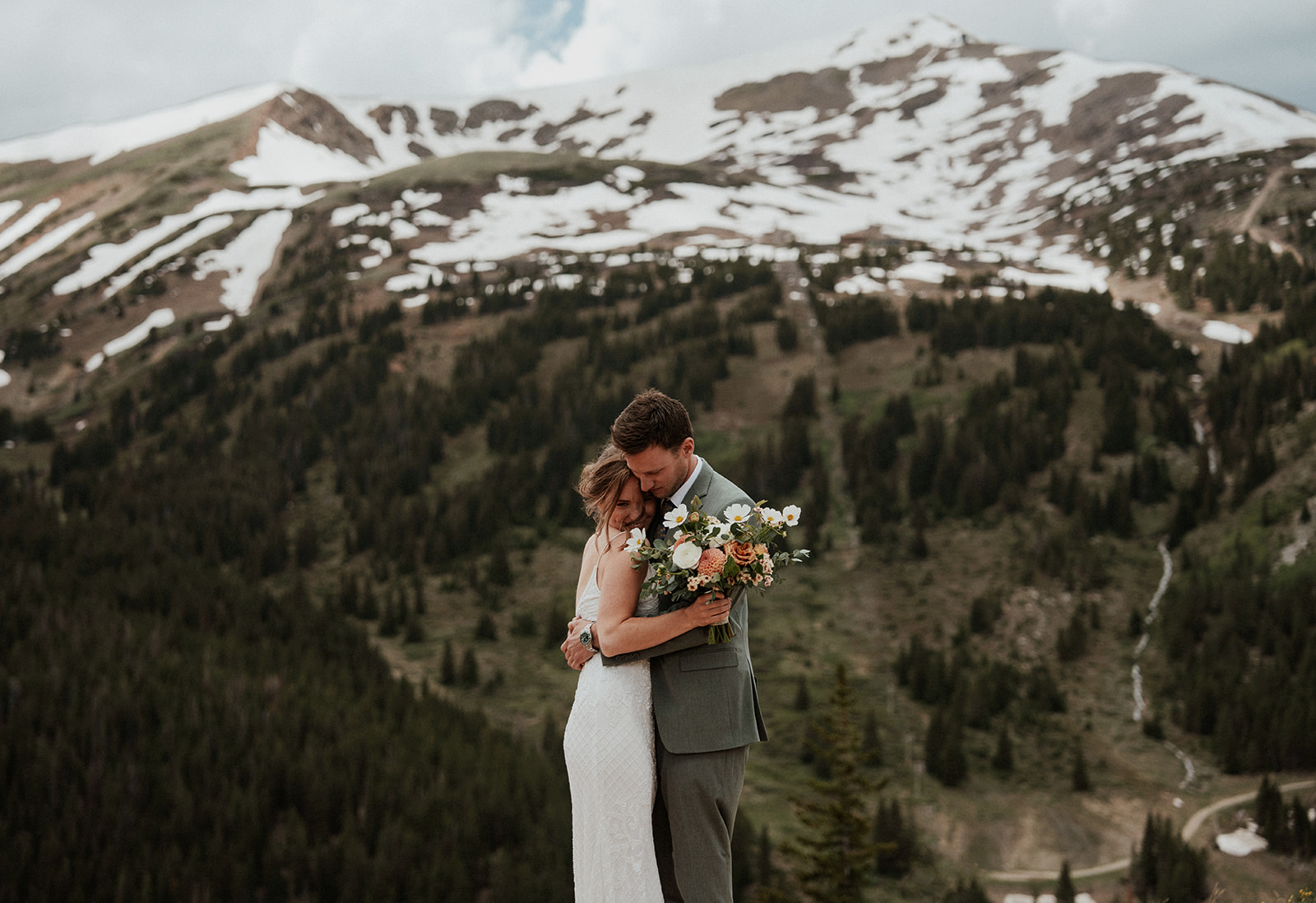 Bride and groom hugging during their Colorado mountain elopement on Peak 9 in Breckenridge 