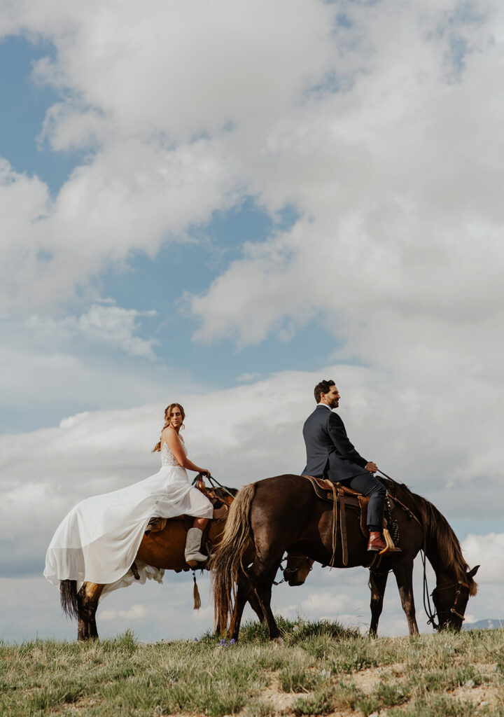 Bride and groom riding horseback for their intimate Hoosier Pass elopement in Colorado