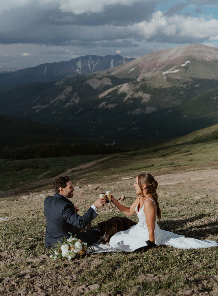 Bride and groom with an elopement picnic at Hoosier Pass in the Colorado mountains