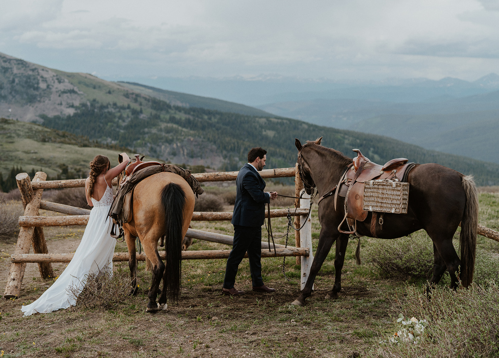 Bride and groom with their horses during their Horseback elopement at Hoosier Pass in Colorado