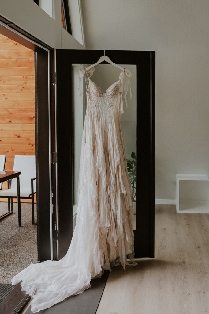 Brides wedding dress from Daci Gowns hanging