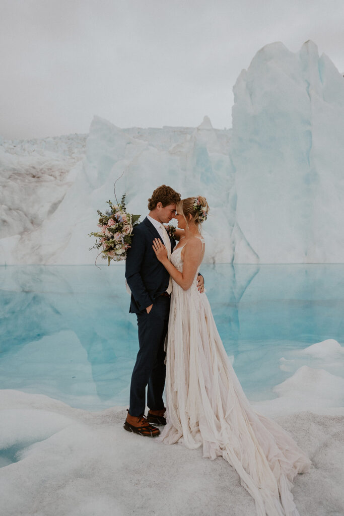 Bride and grooms portraits at Knik Glacier from their Alaska helicopter elopement