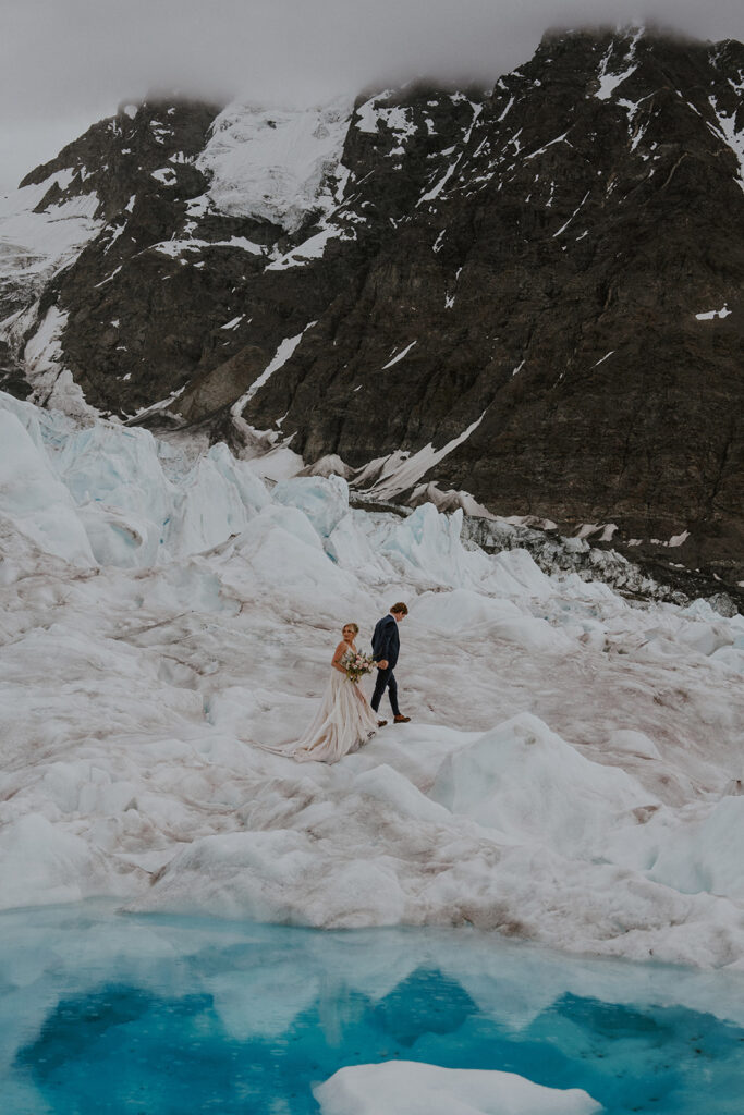 Bride and grooms portraits at Knik Glacier from their Alaska helicopter elopement