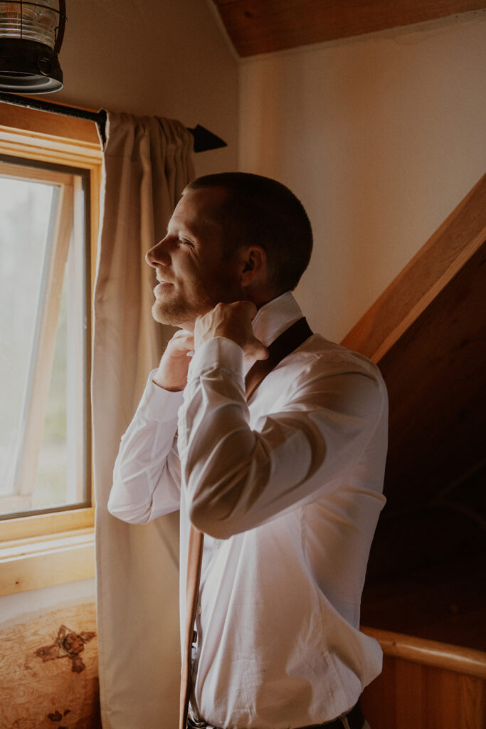 Groom getting ready for her Telluride Colorado elopement at Last Dollar Road