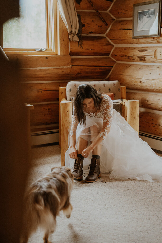 Bride putting her hiking boots on for her Telluride, Colorado elopement