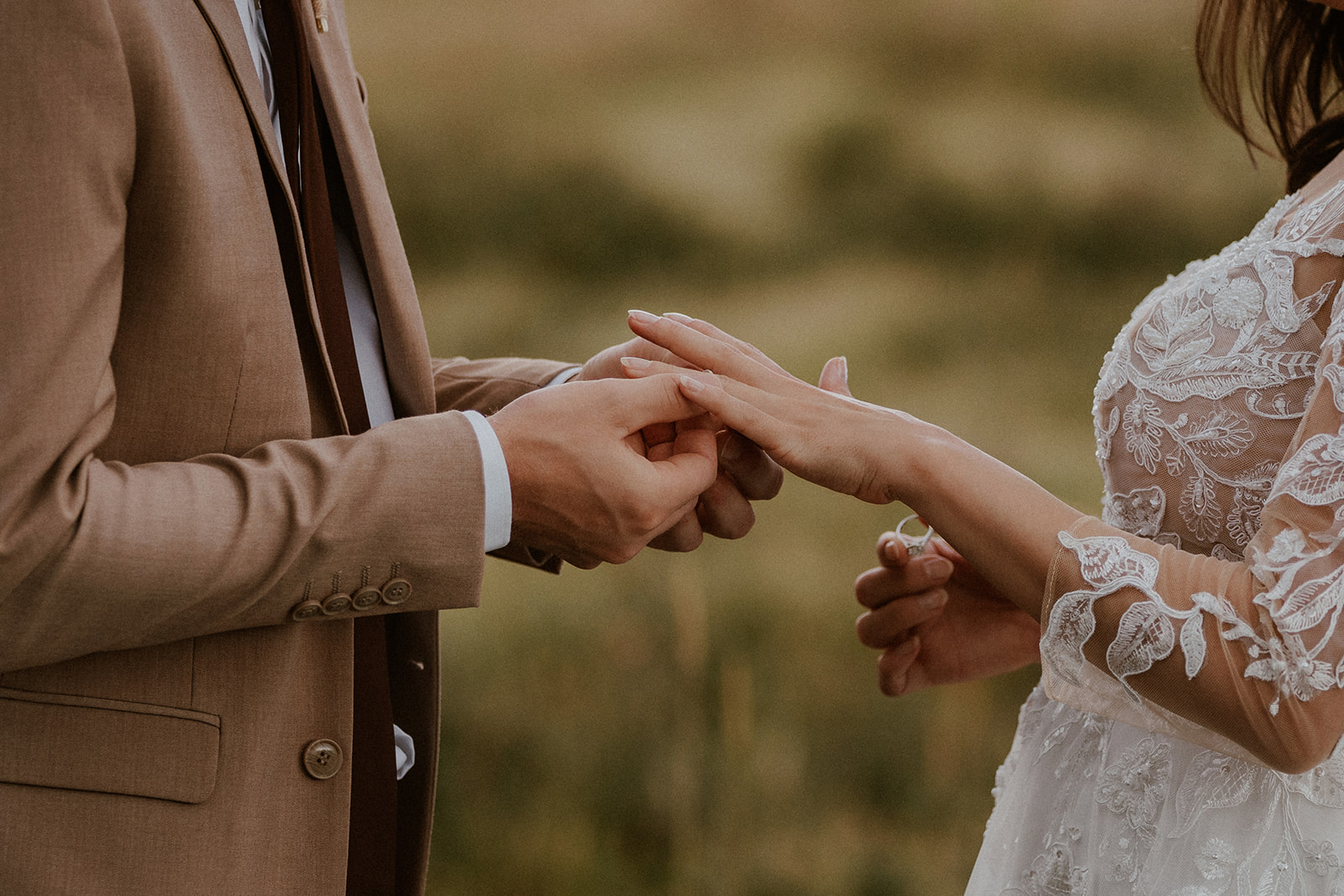 Bride and groom exchanging rings during their elopement ceremony