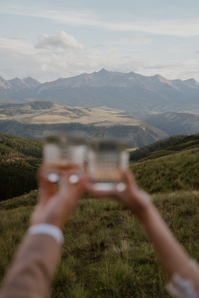 Bride and groom toasting their bourbon during their Telluride, Colorado elopement