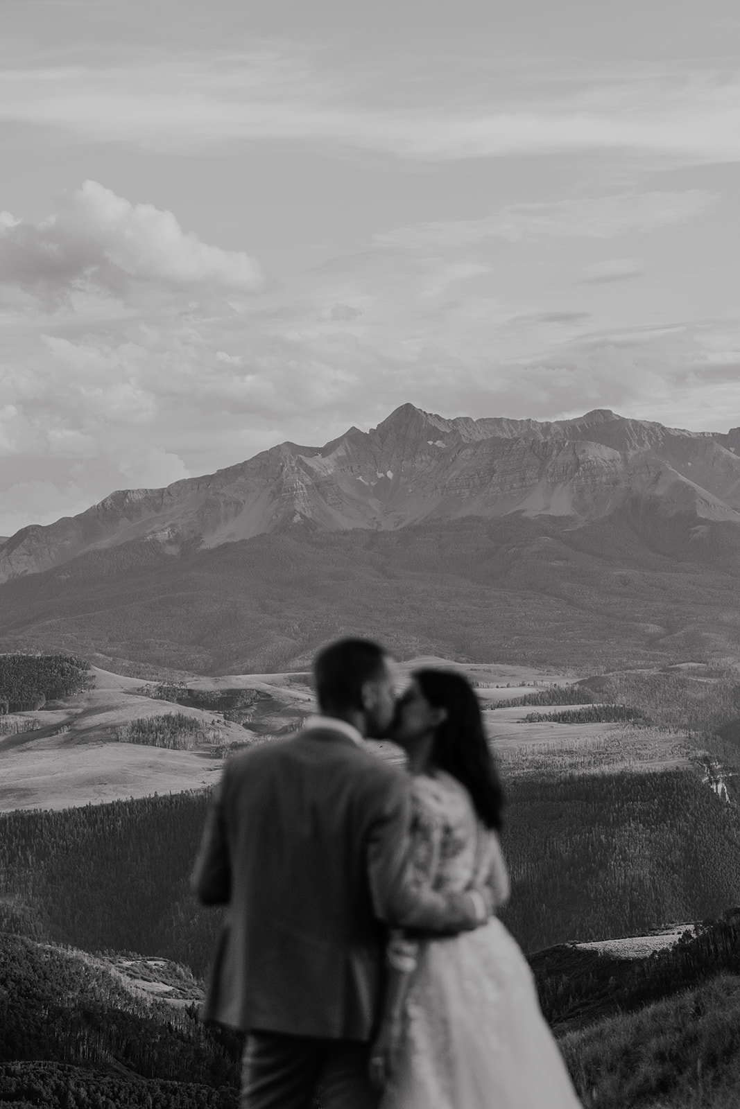 Black and white photo of a bride and groom kissing during their intimate Telluride, Colorado elopement