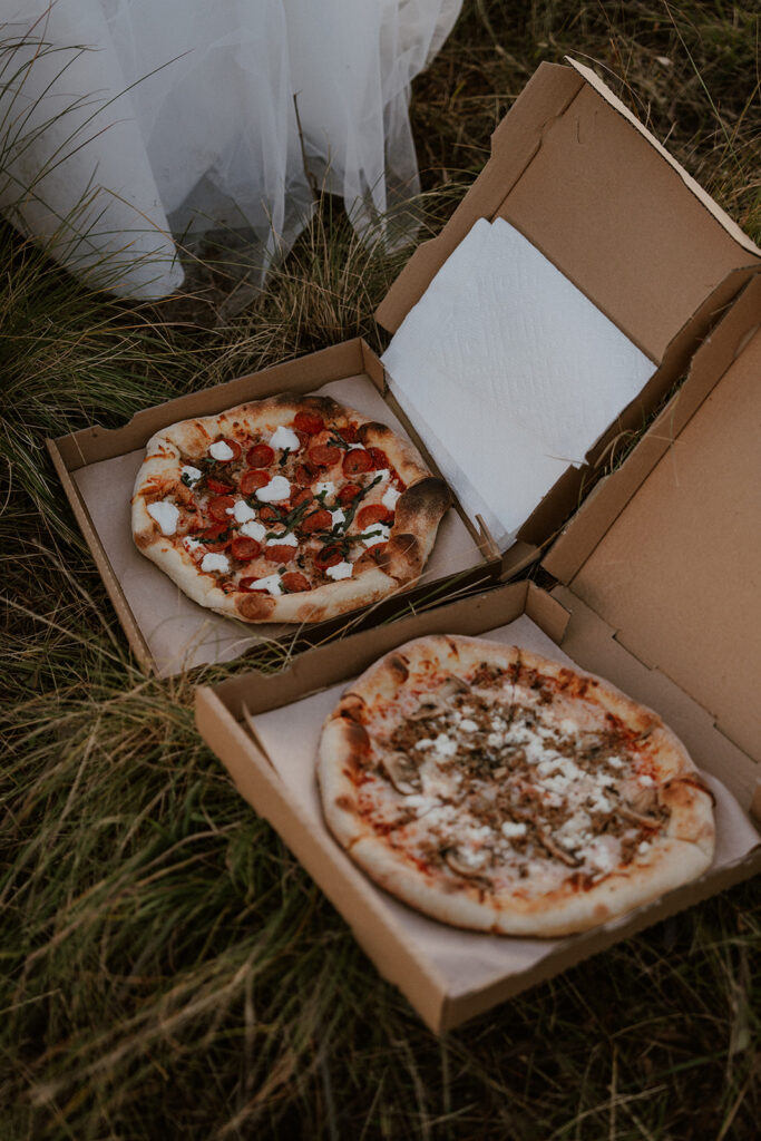 Two pizzas from a elopement reception picnic in the mountains 