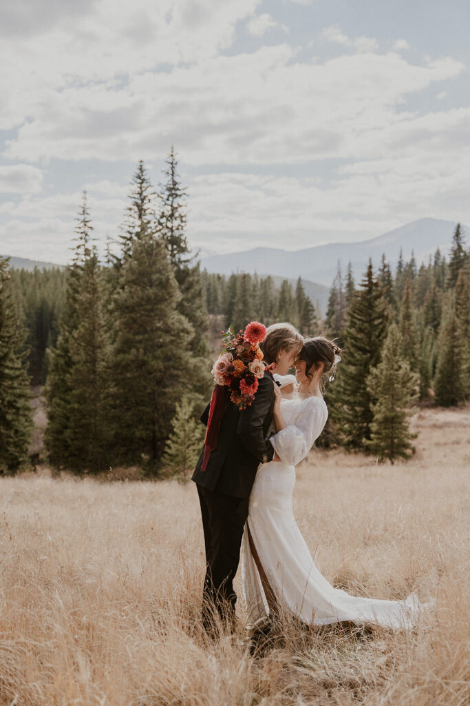 Bride and groom posing at Boreas Pass for their Colorado elopement photos