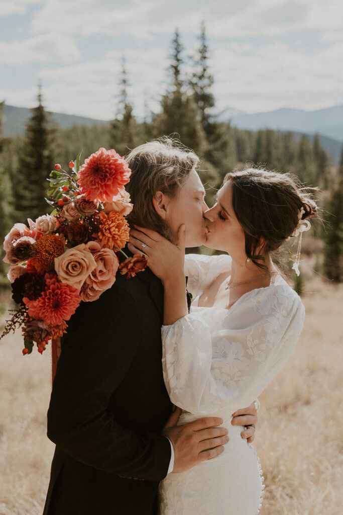 Bride and groom kissing during their Colorado elopement at Boreas Pass