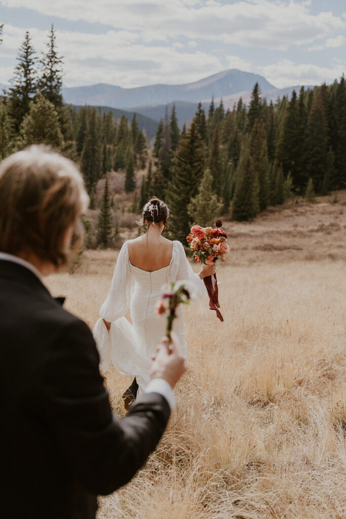 Bride and groom walking out to their ceremony location