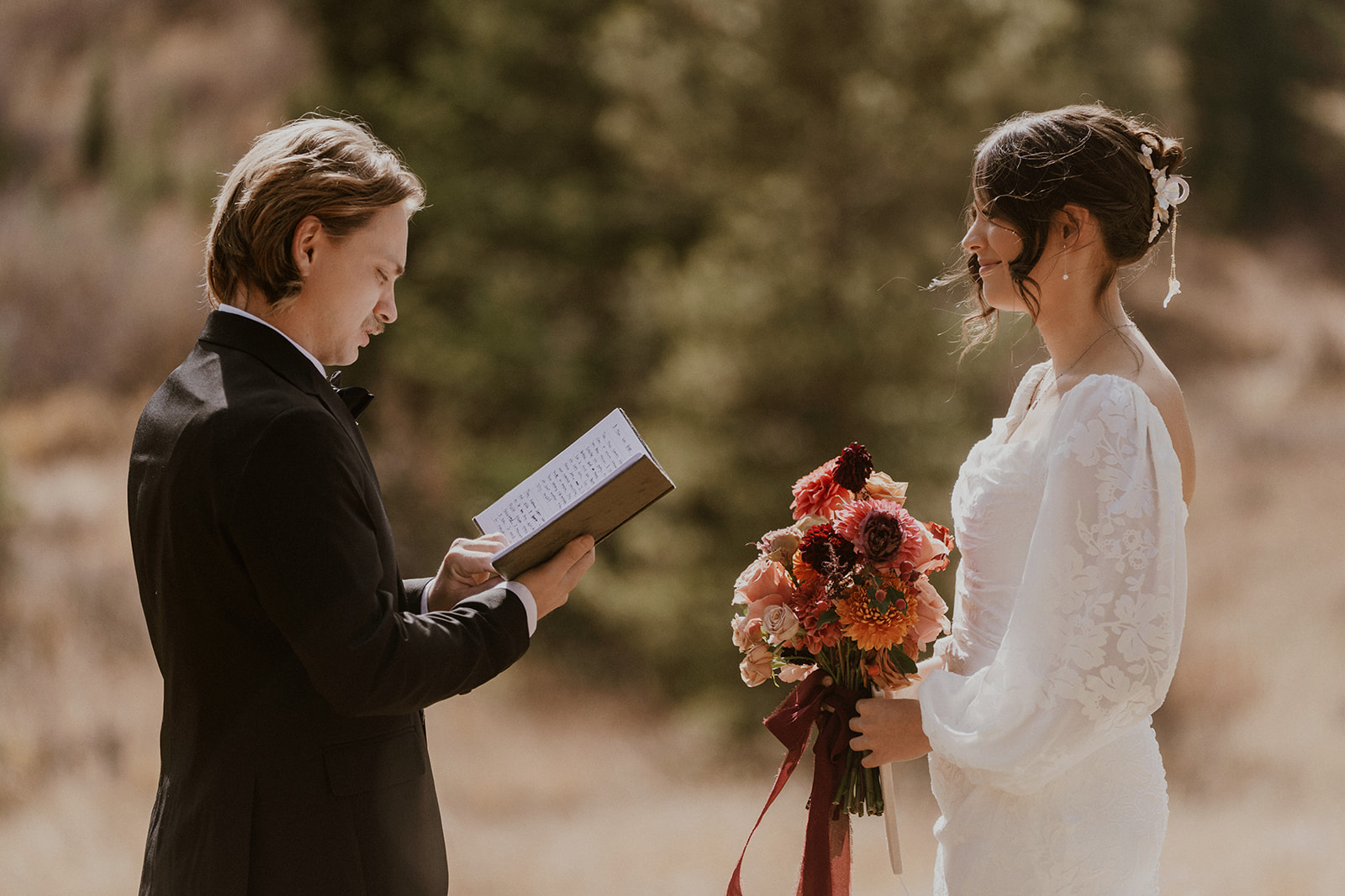 Groom reading his vows to his bride