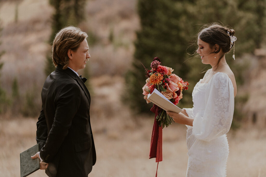 Bride reading her vows to her groom