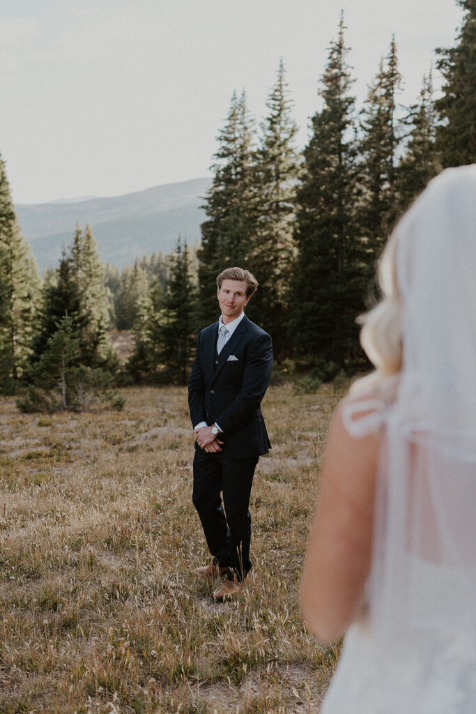 Bride and groom sharing a first look during their intimate Breckenridge wedding in Colorado