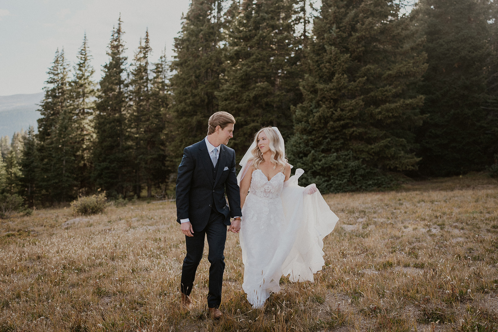 Bride and groom walking together after sharing a first look