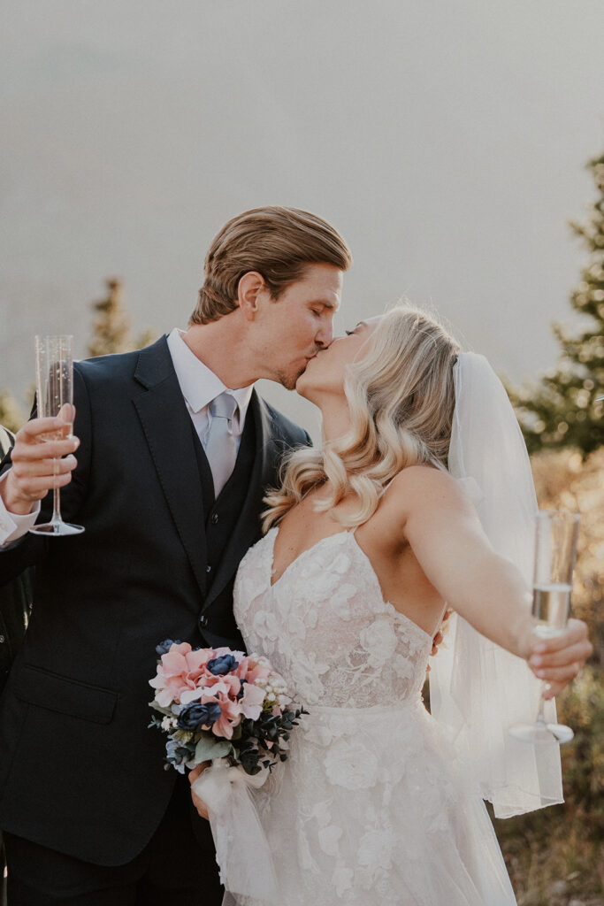 Bride and groom toasting with champagne after their intimate ceremony