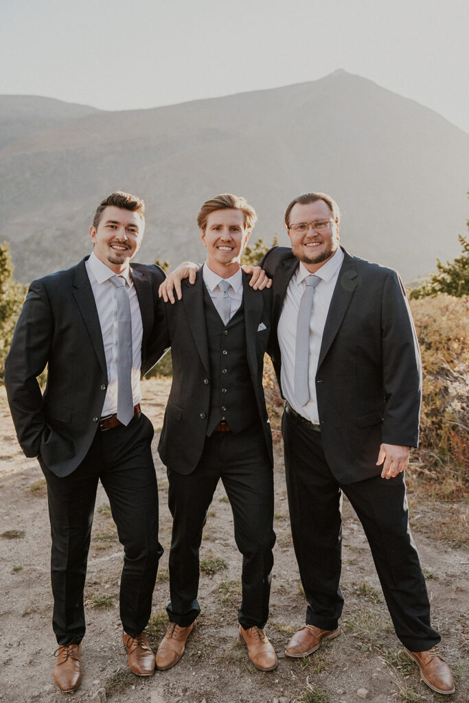 Groom and his groomsmen posing at Hoosier Pass