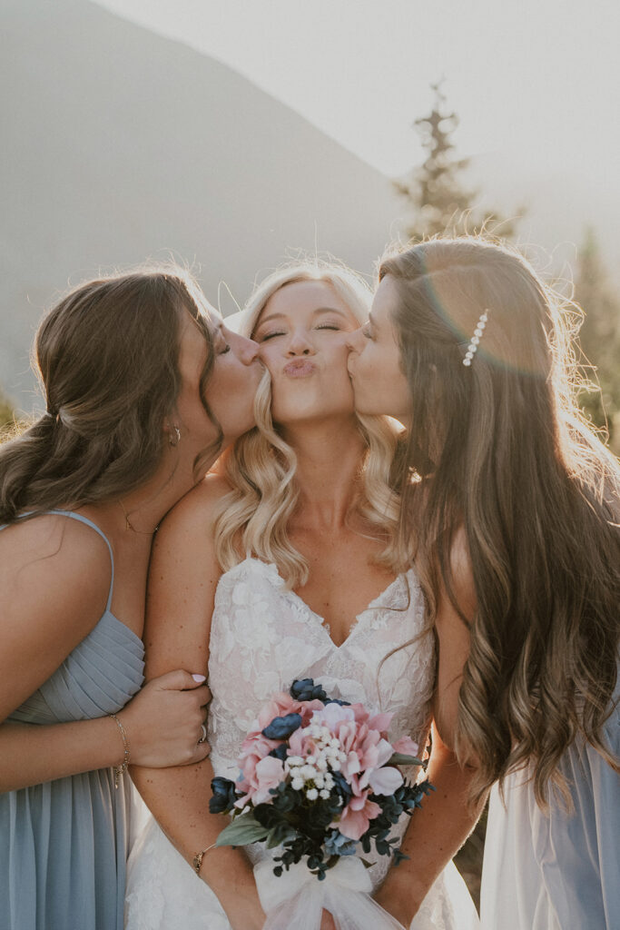 Bride and her bridesmaids posing at Hoosier Pass