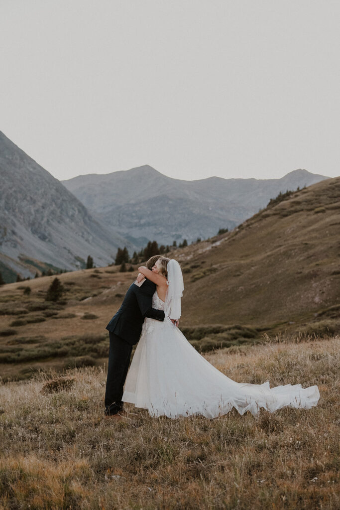 Bride and groom hugging after exchanging private vows