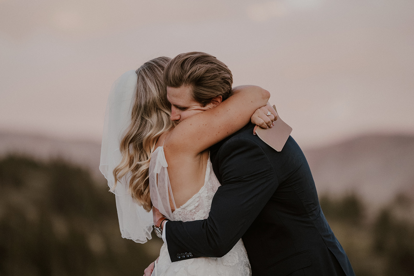 Bride and groom hugging after exchanging vows in Breckenridge Colorado