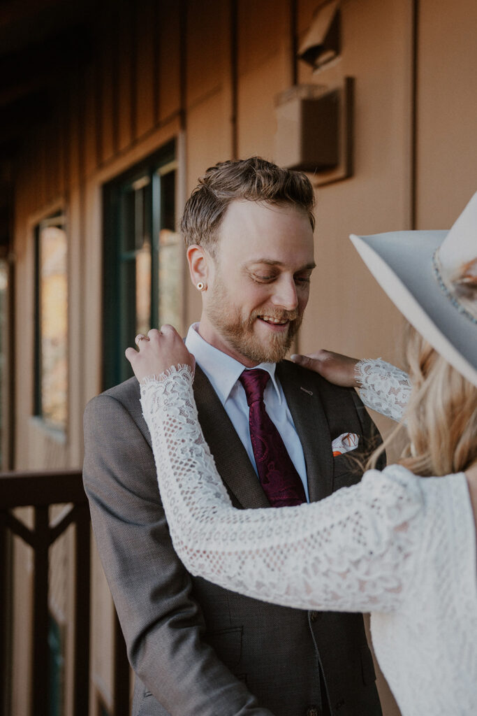 Groom admiring his bride during their first look