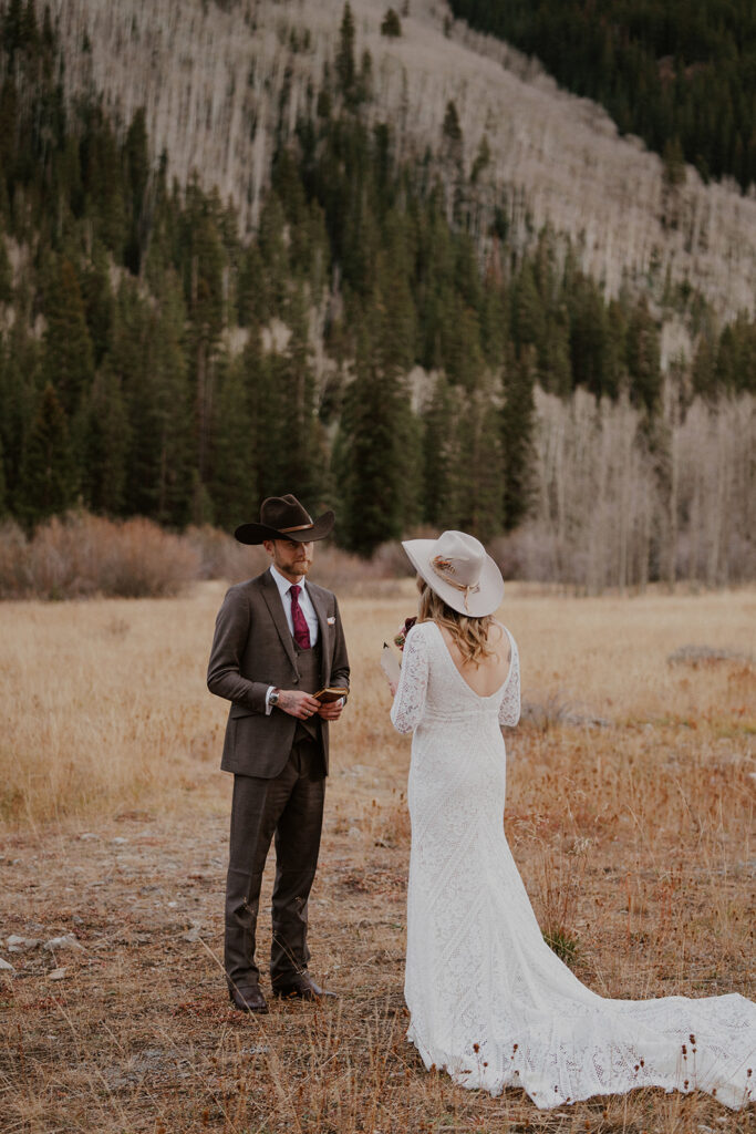 Bride and groom exchanging their intimate vows in the Aspen, Colorado mountains