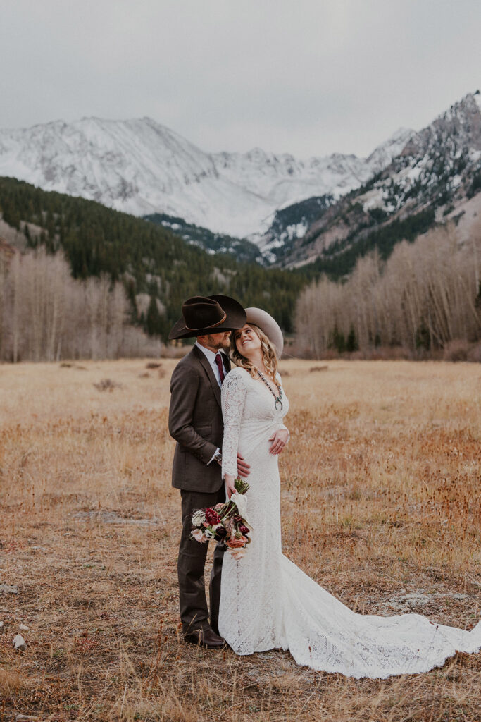 Bride and groom posing for their Aspen, Colorado elopement photos