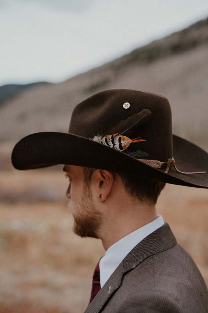 Western groom wearing a cowboy hat