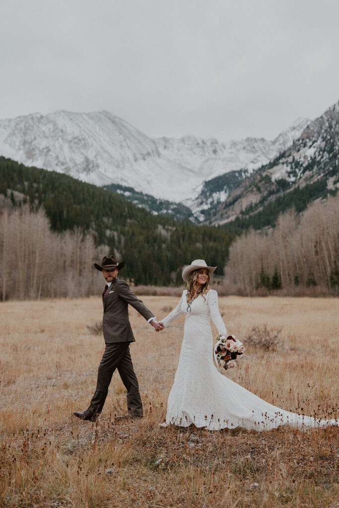 Couple walking through the mountains for their Aspen, Colorado elopement