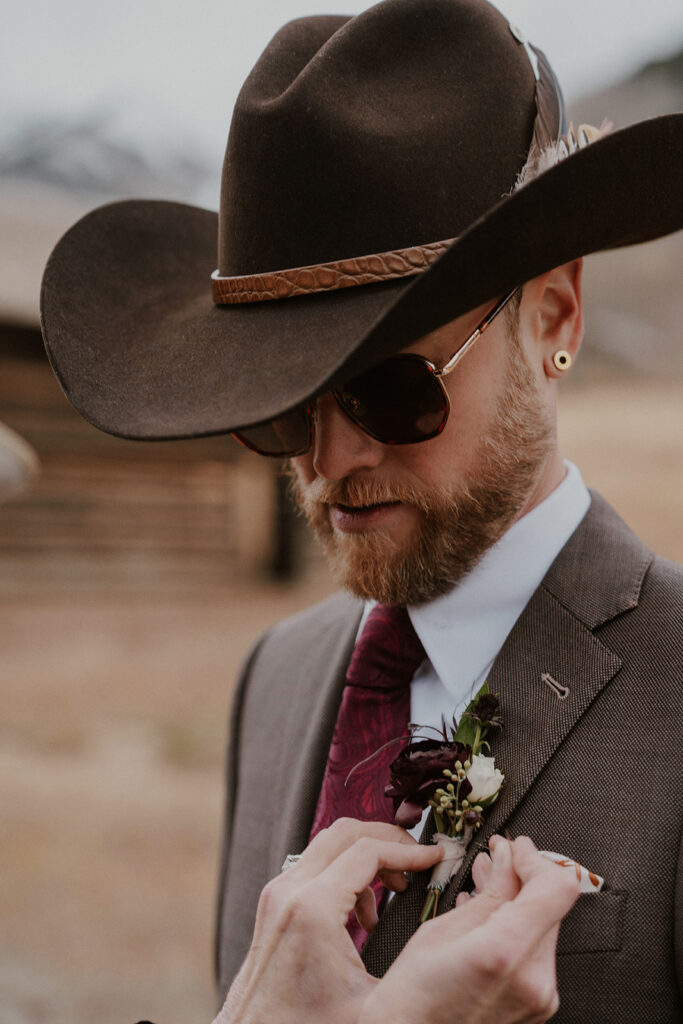 Grooms western-inspired attire for his Ashcroft Ghost Town elopement in Aspen, Colorado